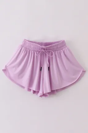 Purple woman sports shorts